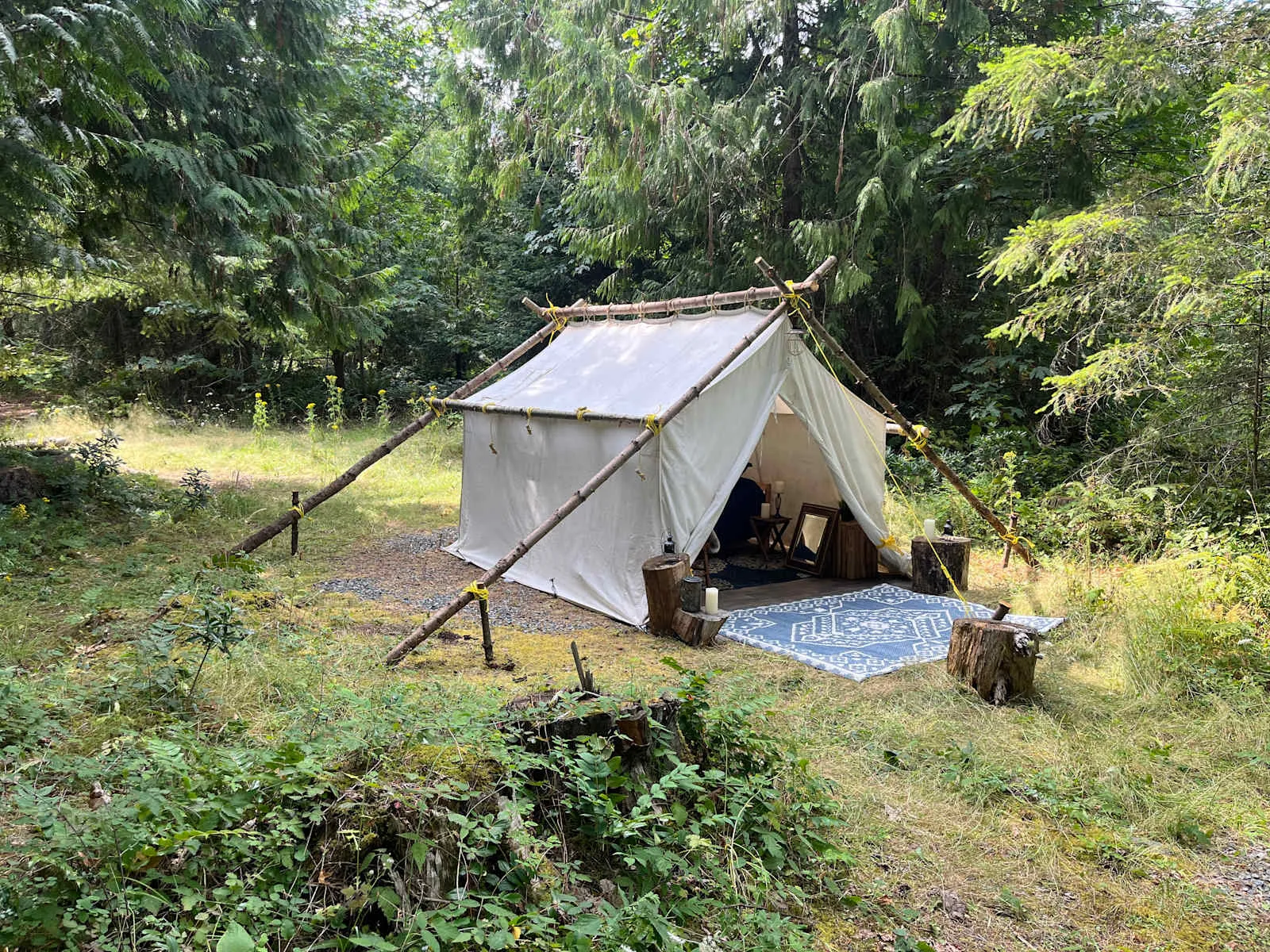 The glamping tent's made-up bed